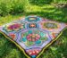 finished octagon motif crochet blanket on grass